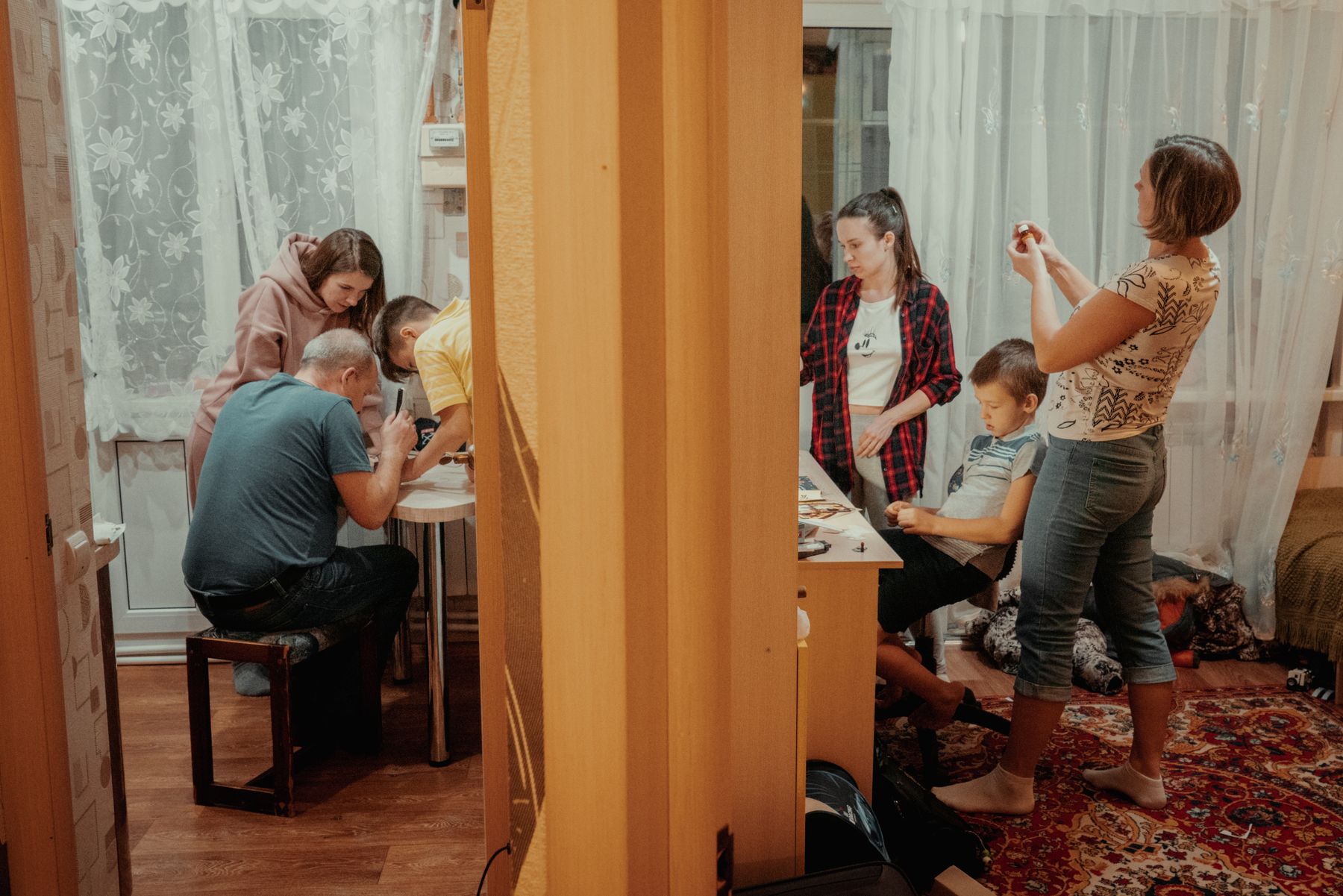 A multigenerational family sharing an evening activity at home
